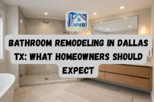 Modern Dallas bathroom remodel featuring a walk-in glass shower, large neutral tile walls, floating wood vanity with double sinks, warm ambient lighting, and natural light from a window in a clean, high-end space.